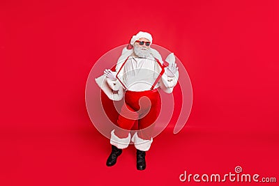 Full length photo of gorgeous white grey hair fat overweight santa in eyewear touch his suspenders feel cool wearing Stock Photo