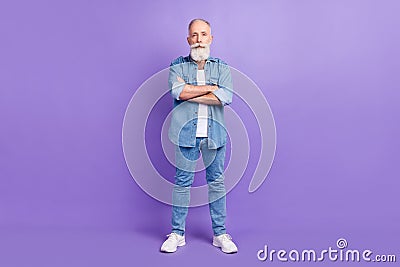 Full length photo of handsome aged man confident serious crossed hands isolated over purple color background Stock Photo