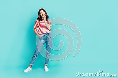 Full length photo of minded pretty lady finger touch face interested look empty space stylish clothes isolated on cyan Stock Photo