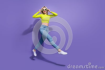 Full length photo of optimistic girl wear stylish clothes going store center seasonal sale empty space on Stock Photo