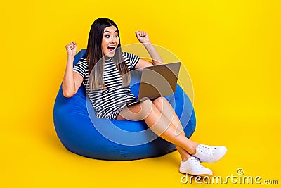 Full length photo overjoyed positive lady sit pouf watch football match rejoice goal celebrate victory isolated on Stock Photo