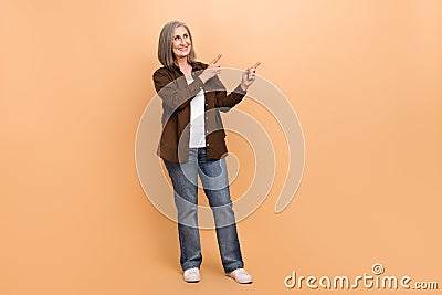 Full length photo pensioner woman white hair wearing brown stylish shirt point fingers novelty banner ad isolated on Stock Photo
