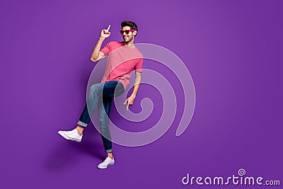 Full length photo of positive cheerful cool energetic guy music lover enjoy dance hip hop night club wear trendy clothes Stock Photo