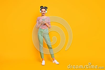 Full length photo of pretty lady use telephone turn on favorite melody modern technology earphones wear red white shirt Stock Photo