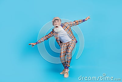 Full length photo of surprised afraid scared man wear checkered stylish outfit go straight high extreme isolated on blue Stock Photo