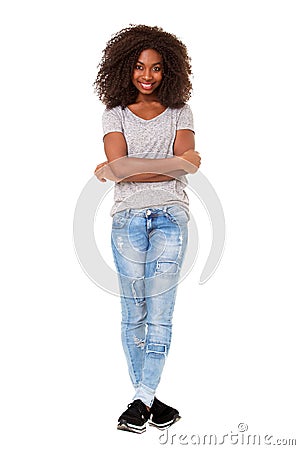 Full length beautiful young african american woman standing with her arms crossed on white background Stock Photo