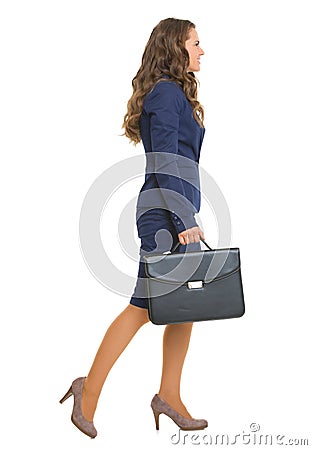 Full length portrait of business woman going sideways Stock Photo