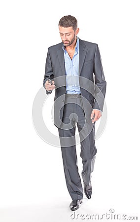 Full length portrait businessman with mobile phone Stock Photo