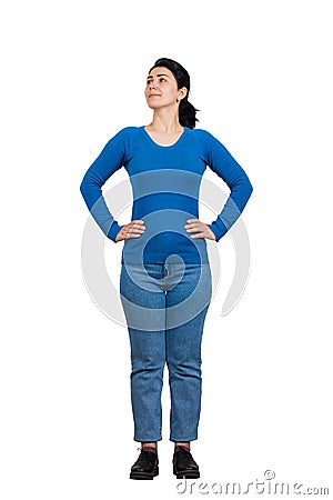 Full length portrait casual young woman posing with hands on hips showing confidence isolated over white background. People Stock Photo