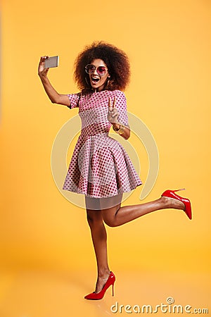 Full length portrait of a cheery afro american woman Stock Photo