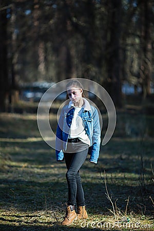 Full-length portrait of teen girl in the pine park Stock Photo