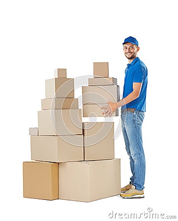 Full length portrait of delivery man holding stack of boxes Stock Photo