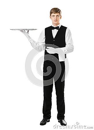 Full length portrait of handsome elegant waiter holding empty si Stock Photo