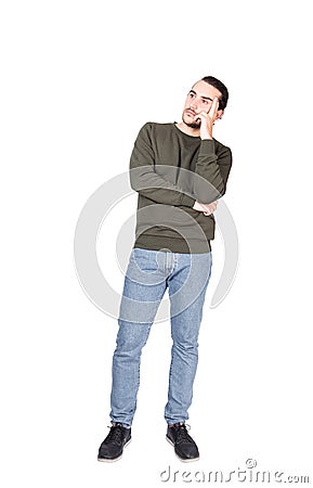 Full length portrait pensive young man, keeps fingers to temple, thoughtful gesture, isolated on white background with copy space Stock Photo