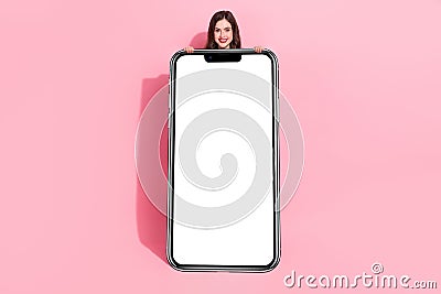 Full length portrait of pretty satisfied girl empty space cover close body isolated on pink color background Stock Photo