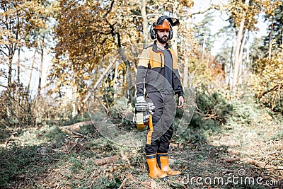Professional lumberjack with chainsaw in the forest Stock Photo
