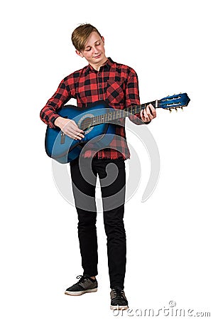 Full length portrait of proud boy teenager playing on the acoustic guitar isolated over white background. Music lessons for Stock Photo