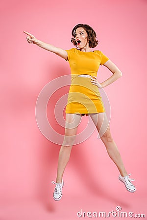 Full length portrait of shocked charming brunette woman with han Stock Photo