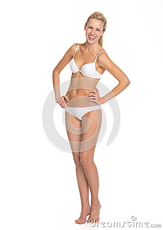 Full length portrait of smiling woman in lingerie Stock Photo