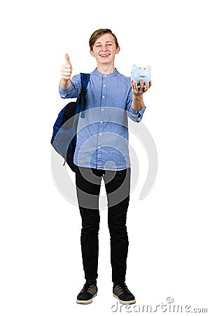 Full length portrait of student boy teenager looking to camera carry a backpack and holding a piggy bank isolated over white Stock Photo