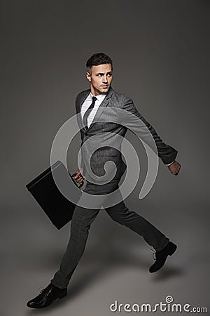 Full length portrait of successful office man dressed in formal Stock Photo