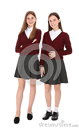 Full length portrait of teenage girls in school uniform on white Stock Photo