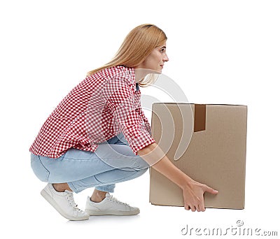 Full length portrait of woman lifting carton box Stock Photo