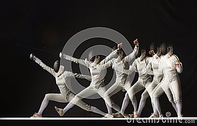 Full-length portrait of woman wearing white fencing costume on black Stock Photo