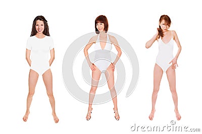 Full length portraits of three beautiful athletic women wearing white swimwear Stock Photo