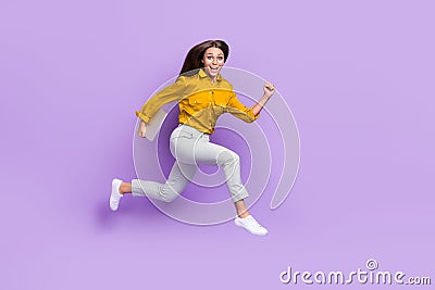 Full length profile photo of active carefree person hold netbook rush jump on violet color background Stock Photo