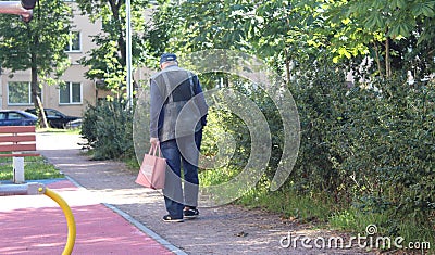 Full length profile shot of a senior man walking in a park Editorial Stock Photo