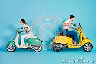 Full length profile side photo crazy two people biker hold clock ride fast road route dont want overtime yellow green Stock Photo