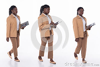 Full length 20s young African American Woman Financial Accountant, walking forward left right step Stock Photo