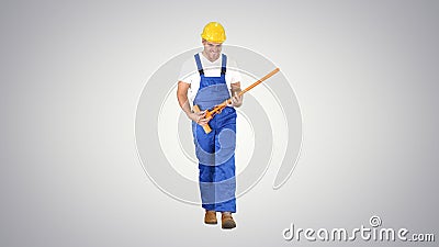 Cheerful man playing on the swob like it is a guitar on gradient Stock Photo