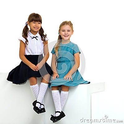 Full length shot of cute sitting girls Stock Photo