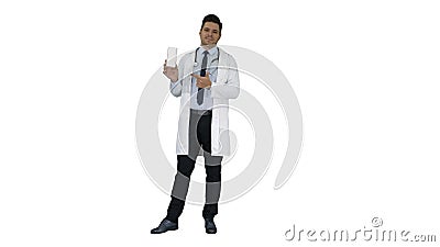 Mature doctor in whitecoat describing new pills in box on white background. Stock Photo