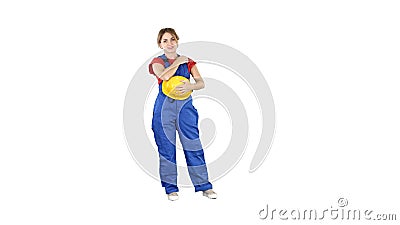 The young woman wear red t-shirt ,with yellow safety helmet ,engineer laughing on white background. Stock Photo