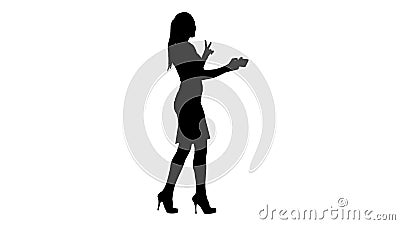 Silhouette Young brunette taking selfie photo on smartphone smiling joyful and walking. Stock Photo