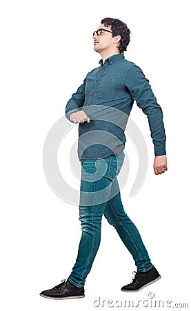 Full length side view of young businessman confident walking isolated on white background. Motion shot, person making a step going Stock Photo