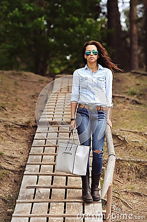 Full length of stylish brunette woman Stock Photo