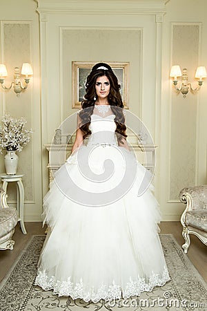 Full length view on beautiful woman posing in a wedding dress. Stock Photo