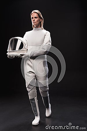 Professional lady astronaut is moving forward Stock Photo