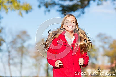 Full of life energy. Child cheerful on fall walk. Warm coat best choice for autumn. Autumn outfit concept. Kid girl wear Stock Photo