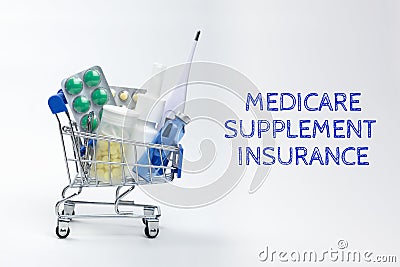 full of medicines little shopping cart and the inscription Medicare supplement insurance Stock Photo