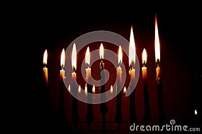 Nine candles full menorah lit on the last night of Hanukkah Stock Photo