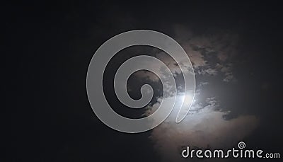 Full moon, bright clouds and moon halo is visible in night time photo shot in Delhi Stock Photo