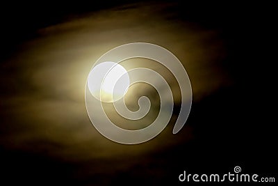 Full moon on dark sky with mist Stock Photo