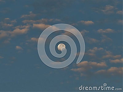 Faraway Full Moon in the Clouds Stock Photo