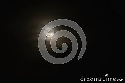 Full moon over dark black sky at night. Mysterious concept with clouds, fog and moon Stock Photo