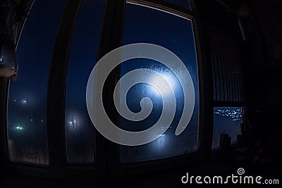 Full moon over the valley in window view. Fisheye lens shot wind angle Stock Photo